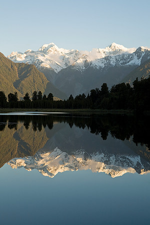 Reflective sunset view across Lake Matheson 5