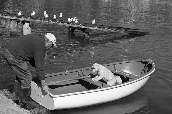 Man with dog in boat 1