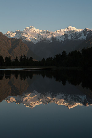 Reflective sunset view across Lake Matheson 3